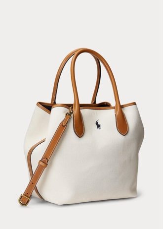 Bolsos tote medianos Bellport de lona reversible Ralph Lauren para mujer en color natural/azul marino