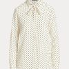 Camisas Ralph Lauren de crepé con cuello anudado y lunares en color crema/azul marino para mujer Camisas Ralph Lauren de crepé con cuello anudado y lunares en color crema/azul marino para mujer