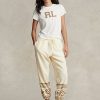 Pantalones deportivos de polar con motivo de copos de nieve de Ralph Lauren para mujer en color crema Pantalones deportivos de polar con motivo de copos de nieve de Ralph Lauren para mujer en color crema