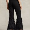 Vaqueros acampanados de tiro alto con ribete de plumas y cuentas de Ralph Lauren para mujer en color negro Vaqueros acampanados de tiro alto con ribete de plumas y cuentas de Ralph Lauren para mujer en color negro