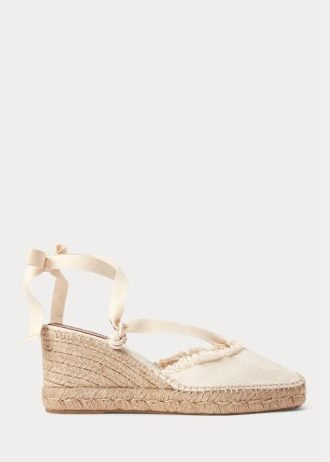 Zapatos planos de cuña de lona con flecos de Ralph Lauren para mujer en color crema Zapatos planos de cuña de lona con flecos de Ralph Lauren para mujer en color crema