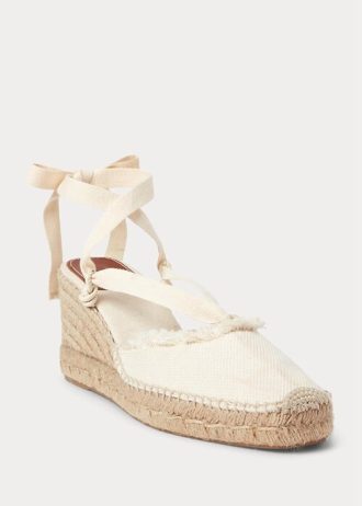 Zapatos planos de cuña de lona con flecos de Ralph Lauren para mujer en color crema Zapatos planos de cuña de lona con flecos de Ralph Lauren para mujer en color crema